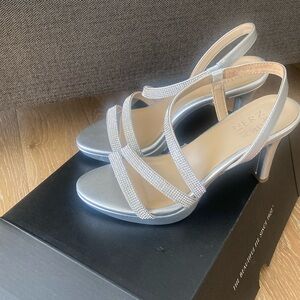 Naturalized silver Brents 2 heels. Worn once.